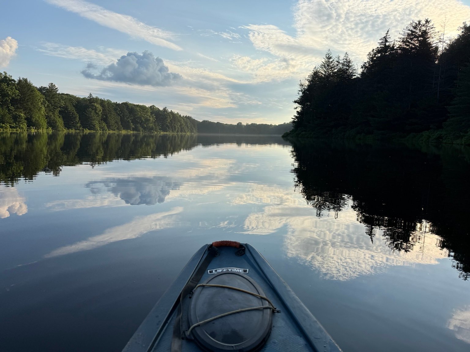 Sunset on a Pennsylvania lake viewed from a kayak.